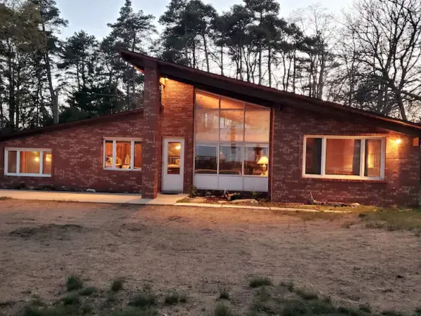 Brick lakefront cottage at dusk in Deckerville, Michigan